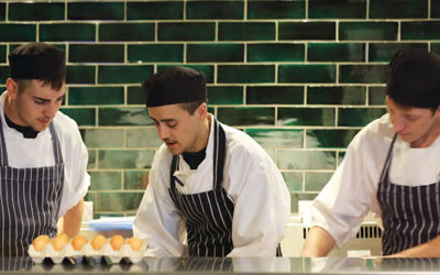 Chefs working in an Oakman Inns kitchen