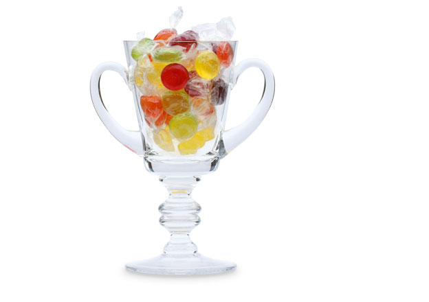 Award-winning copywriter: two-handled glass trophy filled with sweets