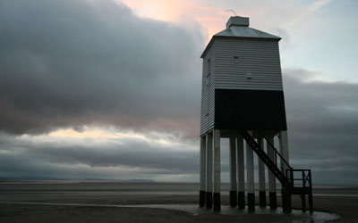 Lighthouse against a dark evening sky